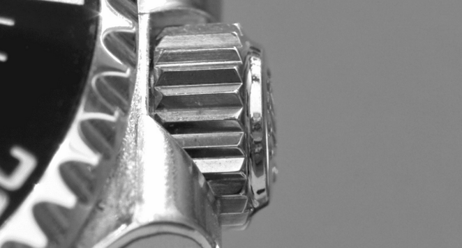 close up of silver watch crown