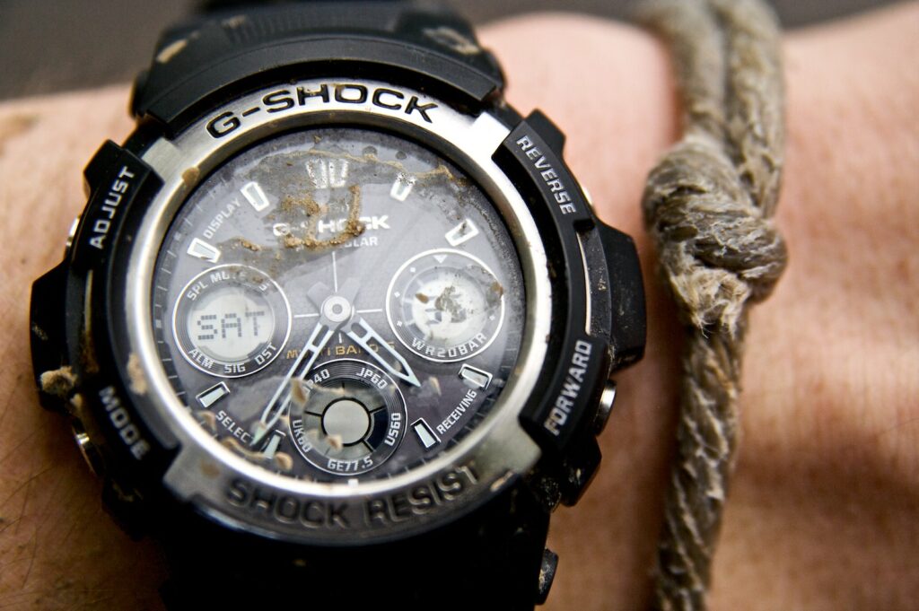 A G-shock watch covered in mud. Our second image in our guide to watch cleaning.