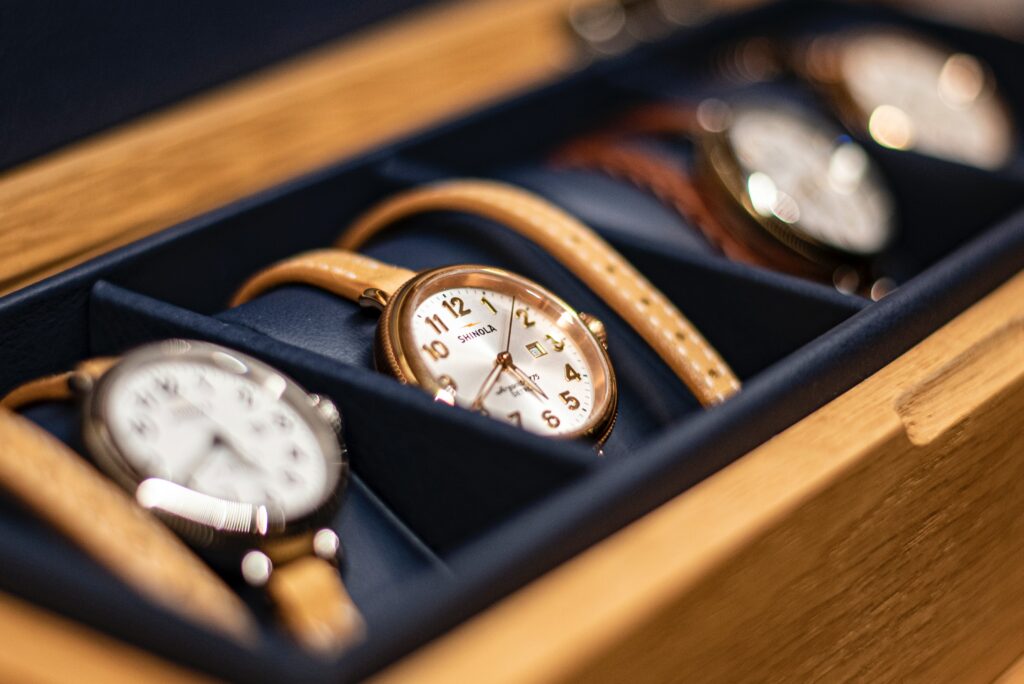 An image of four watches still in their cases. Many watch sellers could be selling multiple watches. If you're looking for pre-owned watches for sale, make sure to do your res